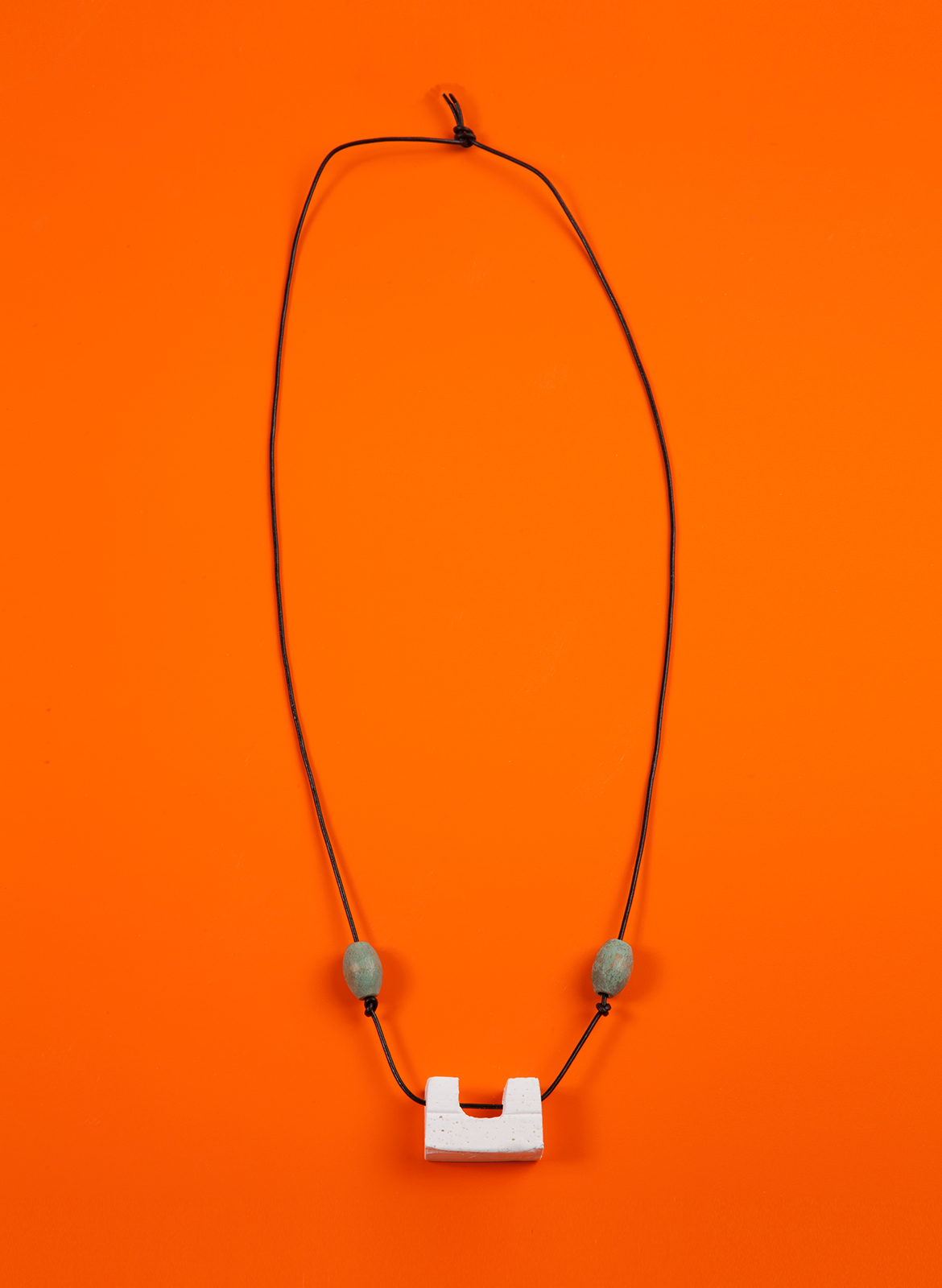 chadkouri-modularnecklace-orangebackground